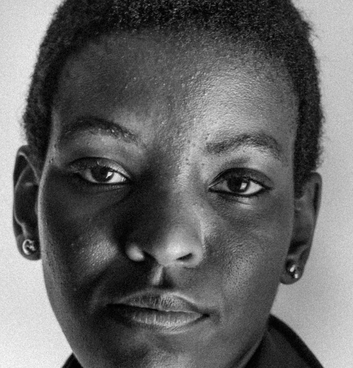 A close-up photo of a woman looking at the camera